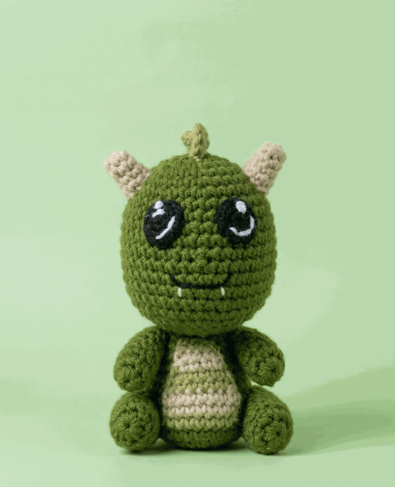 Small green crochet dragon